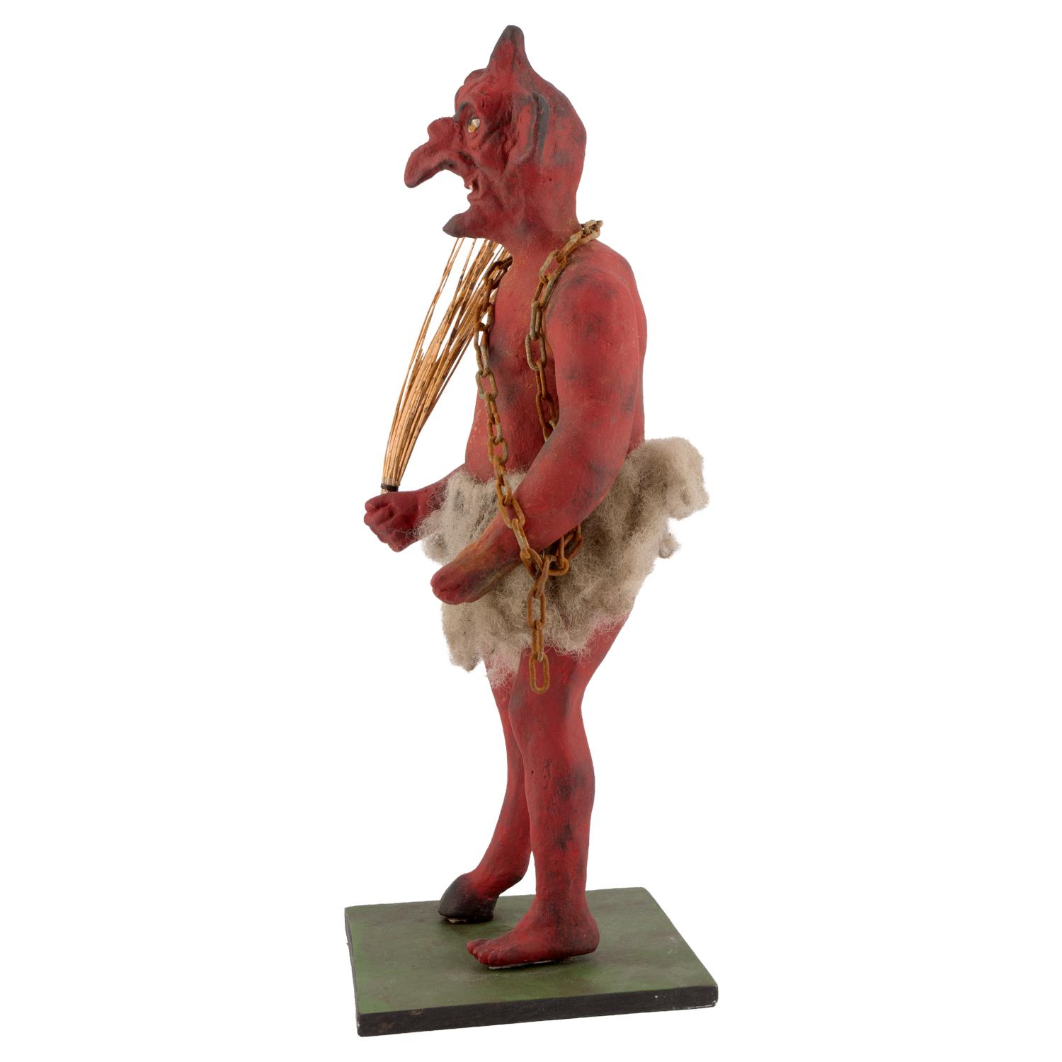 Rote Krampus-Dekofigur mit Kette und Rute auf Sockel