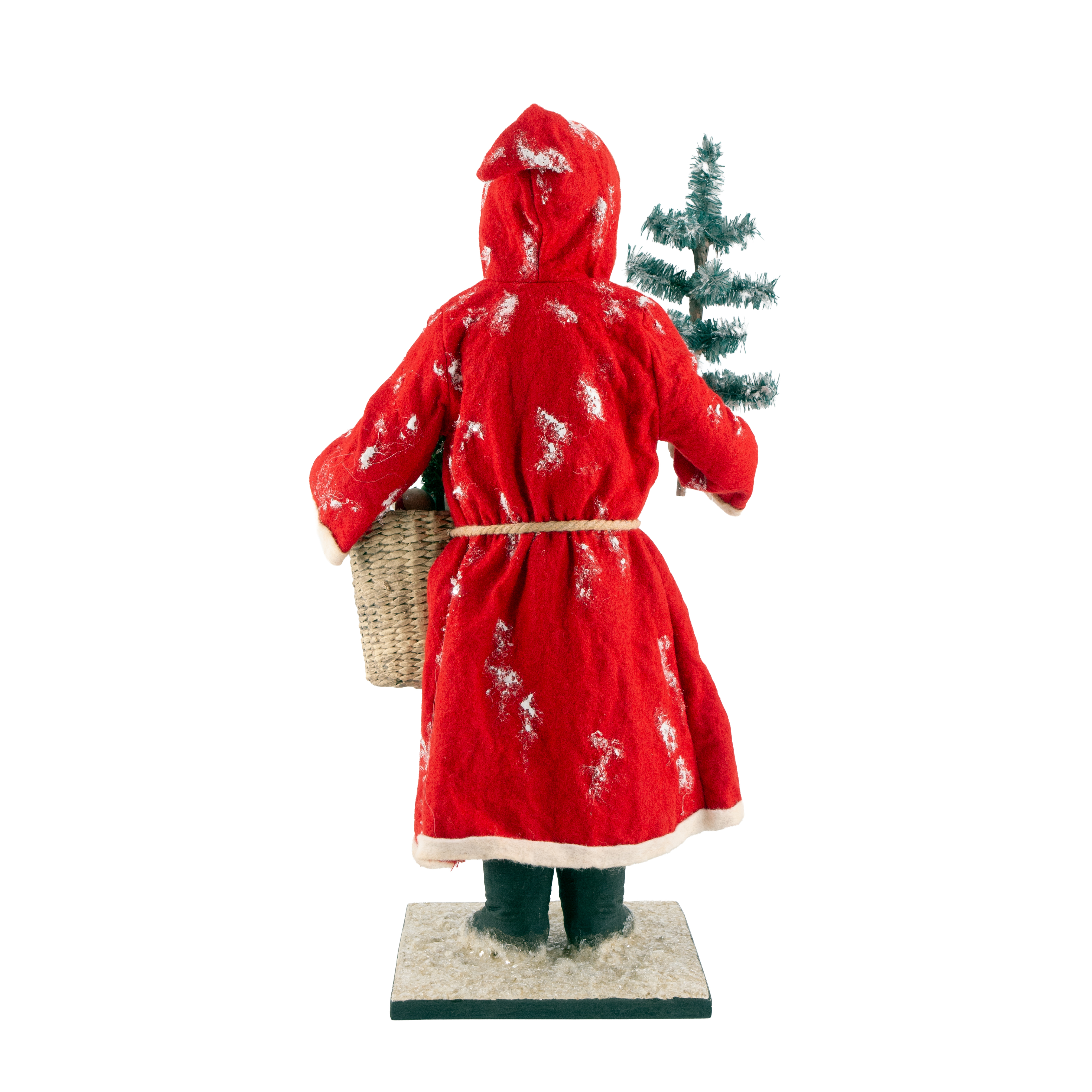 Rote Weihnachtsfigur mit Korb und kleinem Tannenbaum